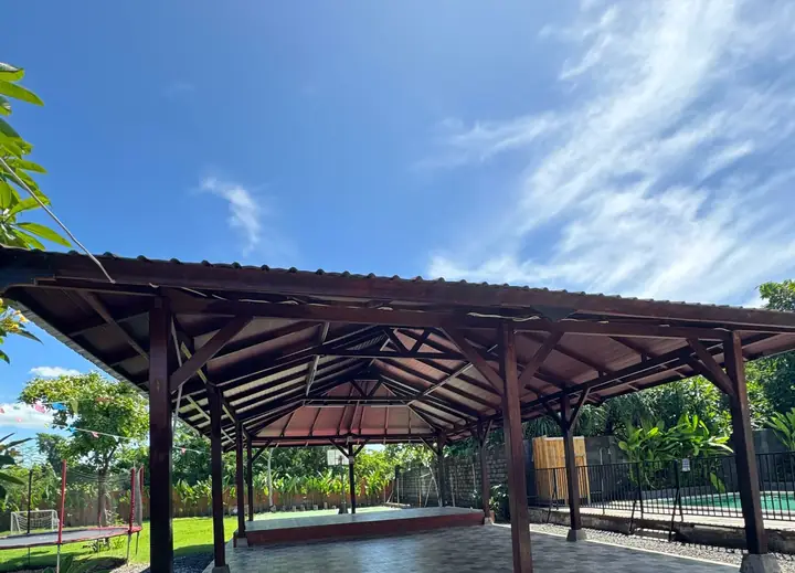 Wooden pavilion under a blue sky